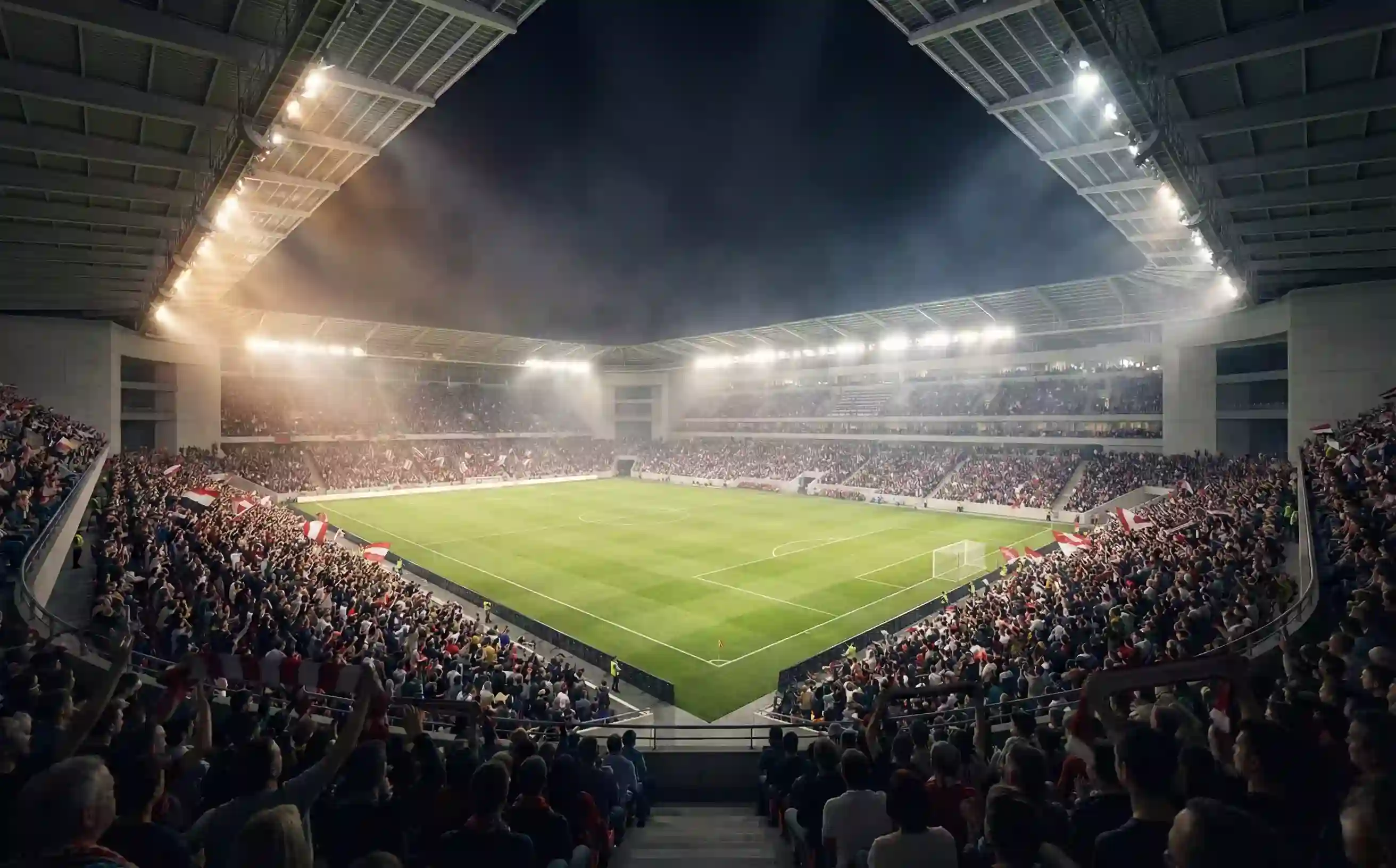 Fußballstadion bei Flutlicht während eines Live-Spiels mit spannender Atmosphäre